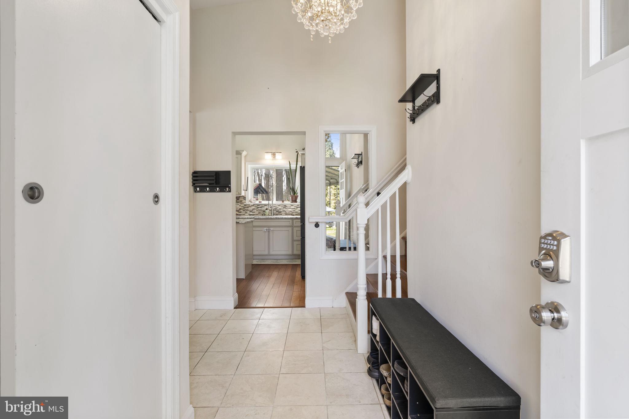 352 South New Middletown Road Media, PA 19063 - Photo 4 of 41 a view of a hallway with wooden floor and staircase