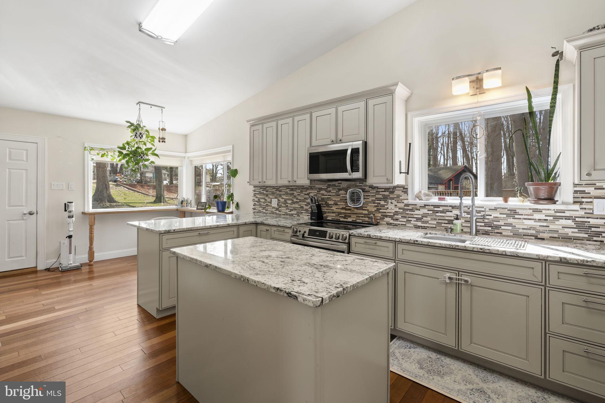352 South New Middletown Road Media, PA 19063 - Photo 9 of 41 a kitchen with stainless steel appliances granite countertop a sink stove and refrigerator