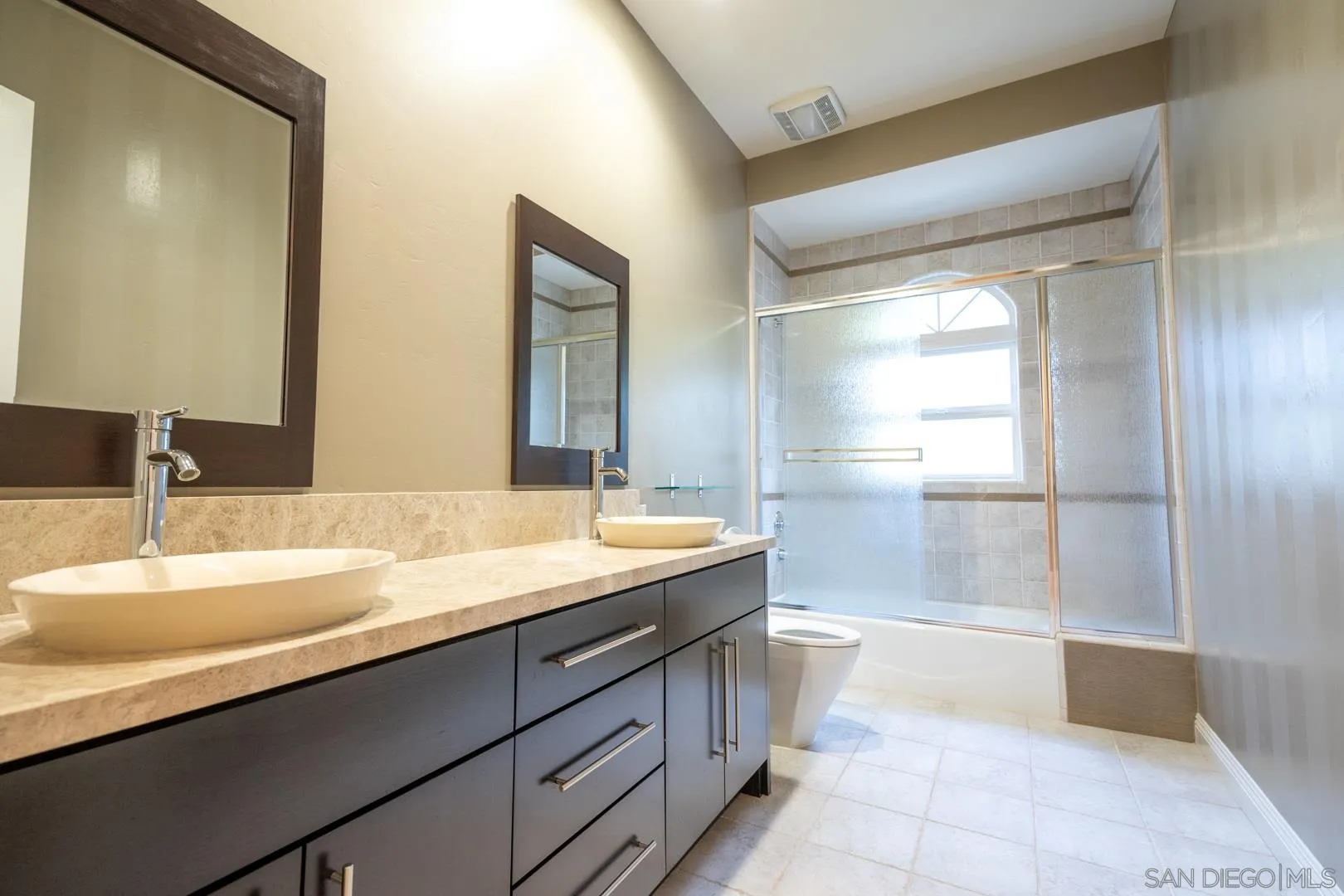 14184 Ridge Canyon Road Valley Center, CA 92082 - Photo 16 of 39 a bathroom with a granite countertop sink mirror and a