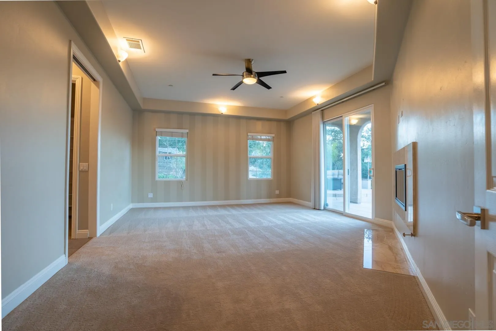 14184 Ridge Canyon Road Valley Center, CA 92082 - Photo 18 of 39 en empty room with windows and ceiling fan