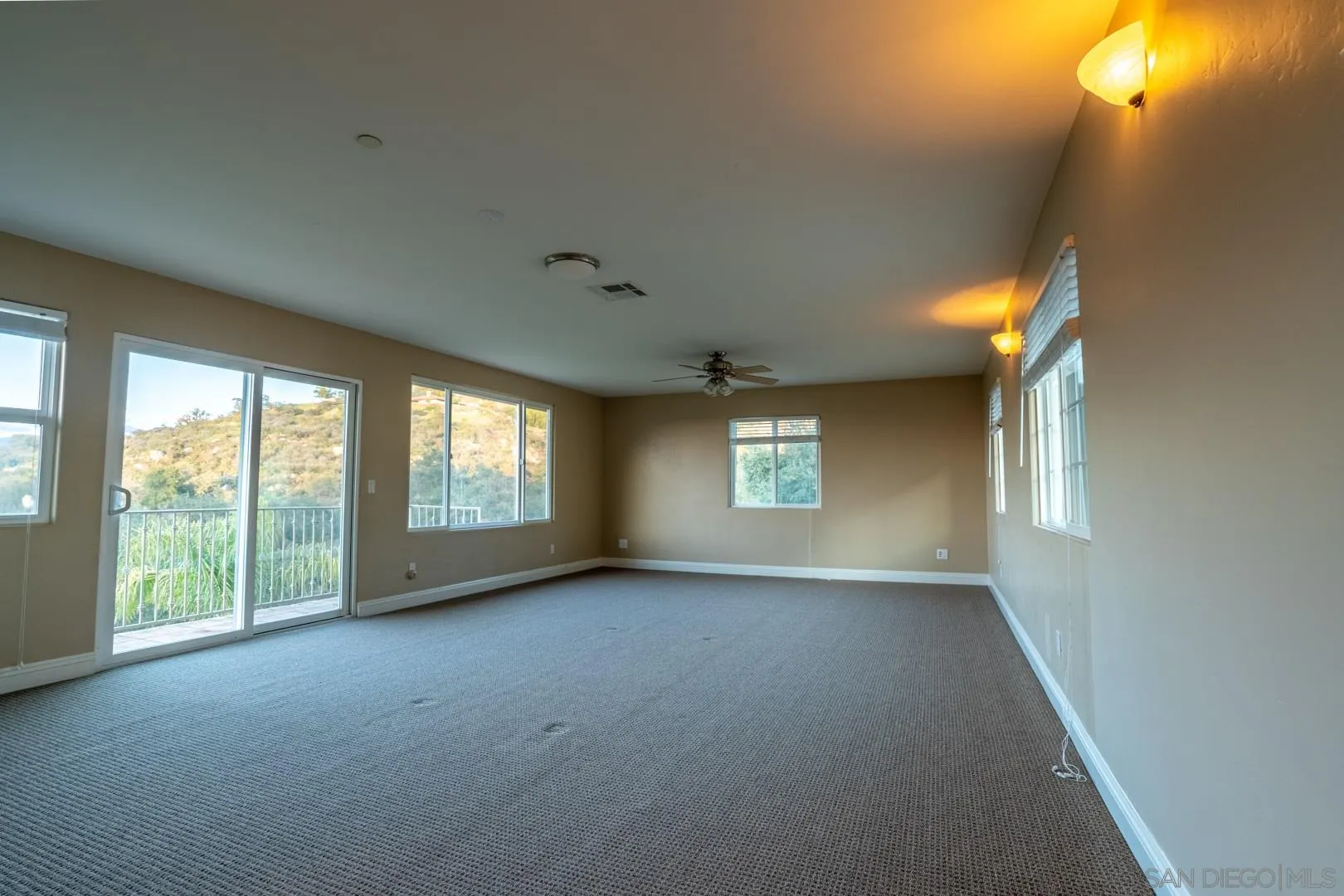 14184 Ridge Canyon Road Valley Center, CA 92082 - Photo 23 of 39 wooden floor and windows in an empty room