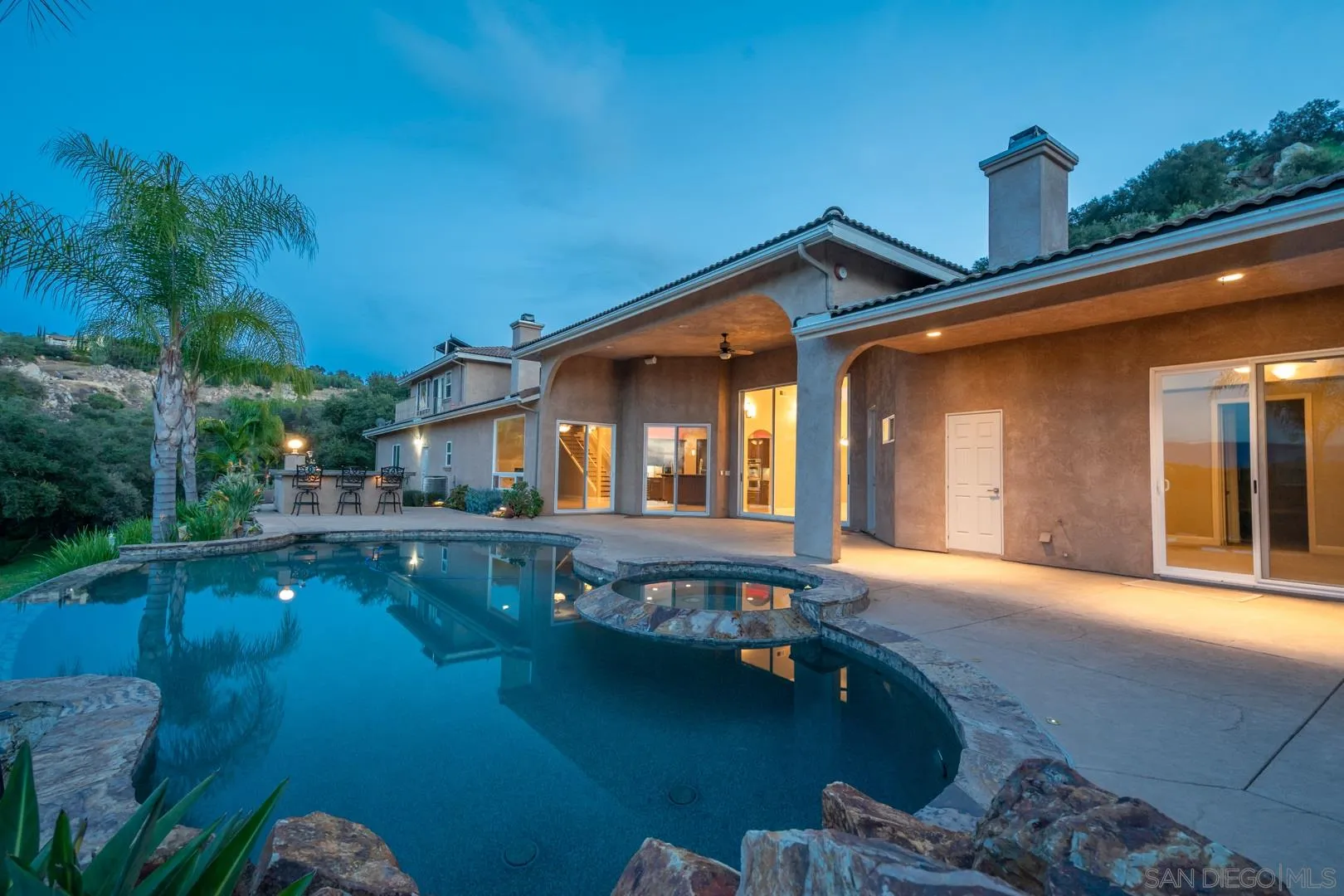 14184 Ridge Canyon Road Valley Center, CA 92082 - Photo 28 of 39 a view of a house with pool porch and wooden floor