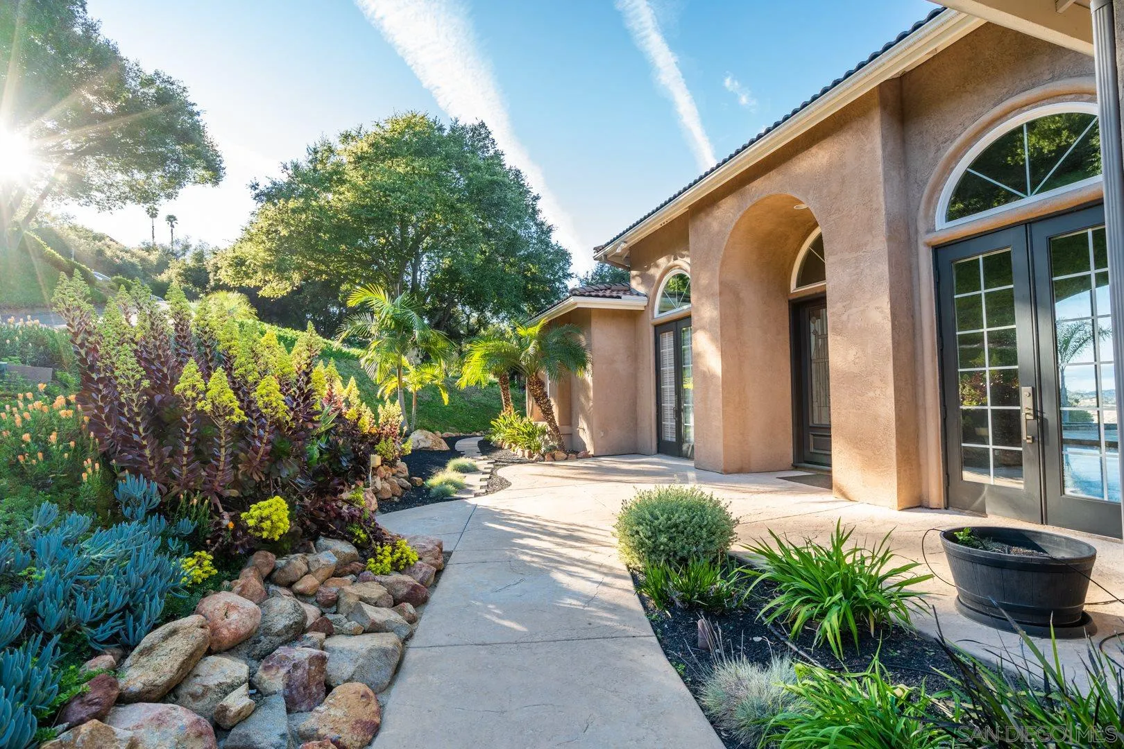 14184 Ridge Canyon Road Valley Center, CA 92082 - Photo 4 of 39 a front view of a house with a yard