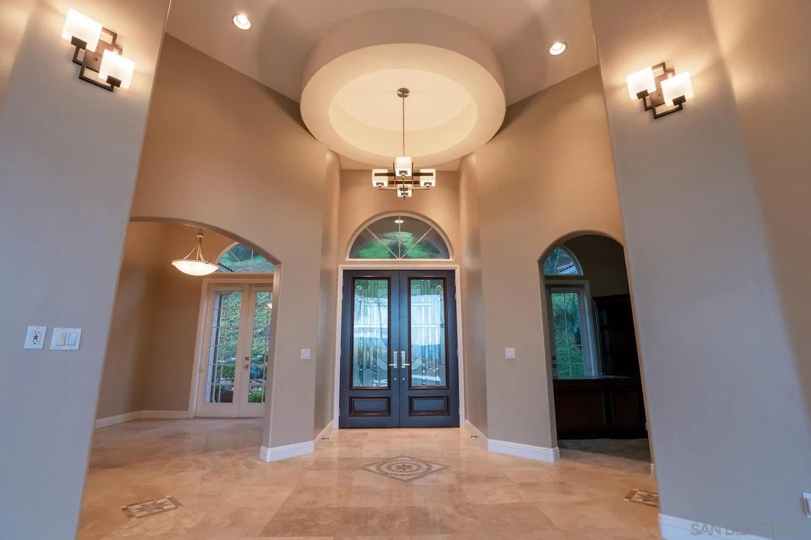 14184 Ridge Canyon Road Valley Center, CA 92082 - Photo 7 of 39 a view of a room with chandelier fan and glass door