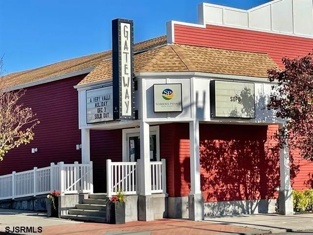 a front view of a building with glass windows and door