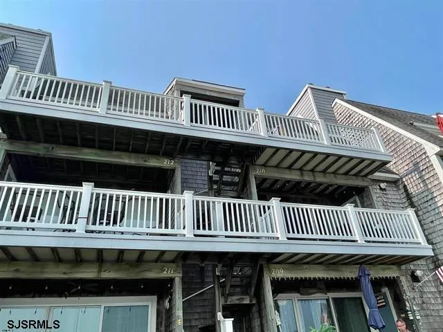 a view of a roof deck with a fence