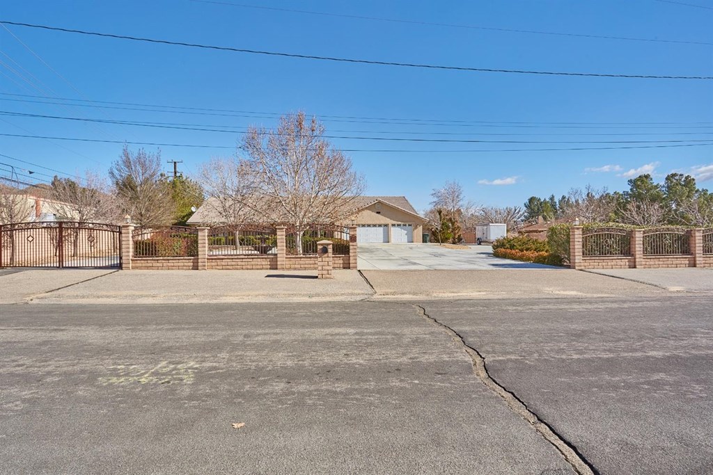 15649 Atnah Road Apple Valley, CA 92307 - Photo 1 of 1 a building with trees in front of it