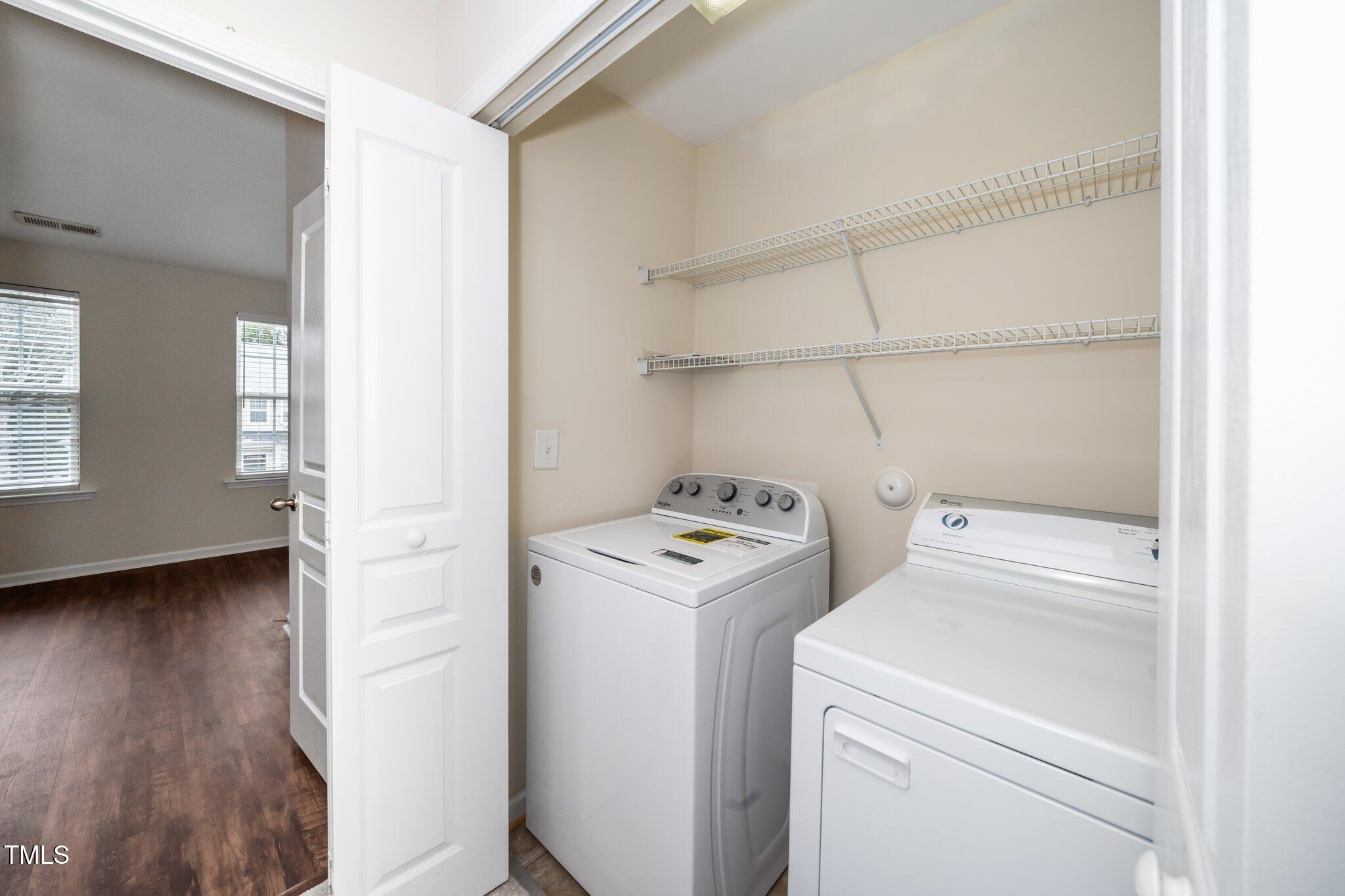 7753 Winners Edge Street Raleigh, NC 27617 - Photo 25 of 46 Laundry is conveniently located near the primary suite. Washer & dryer remain.