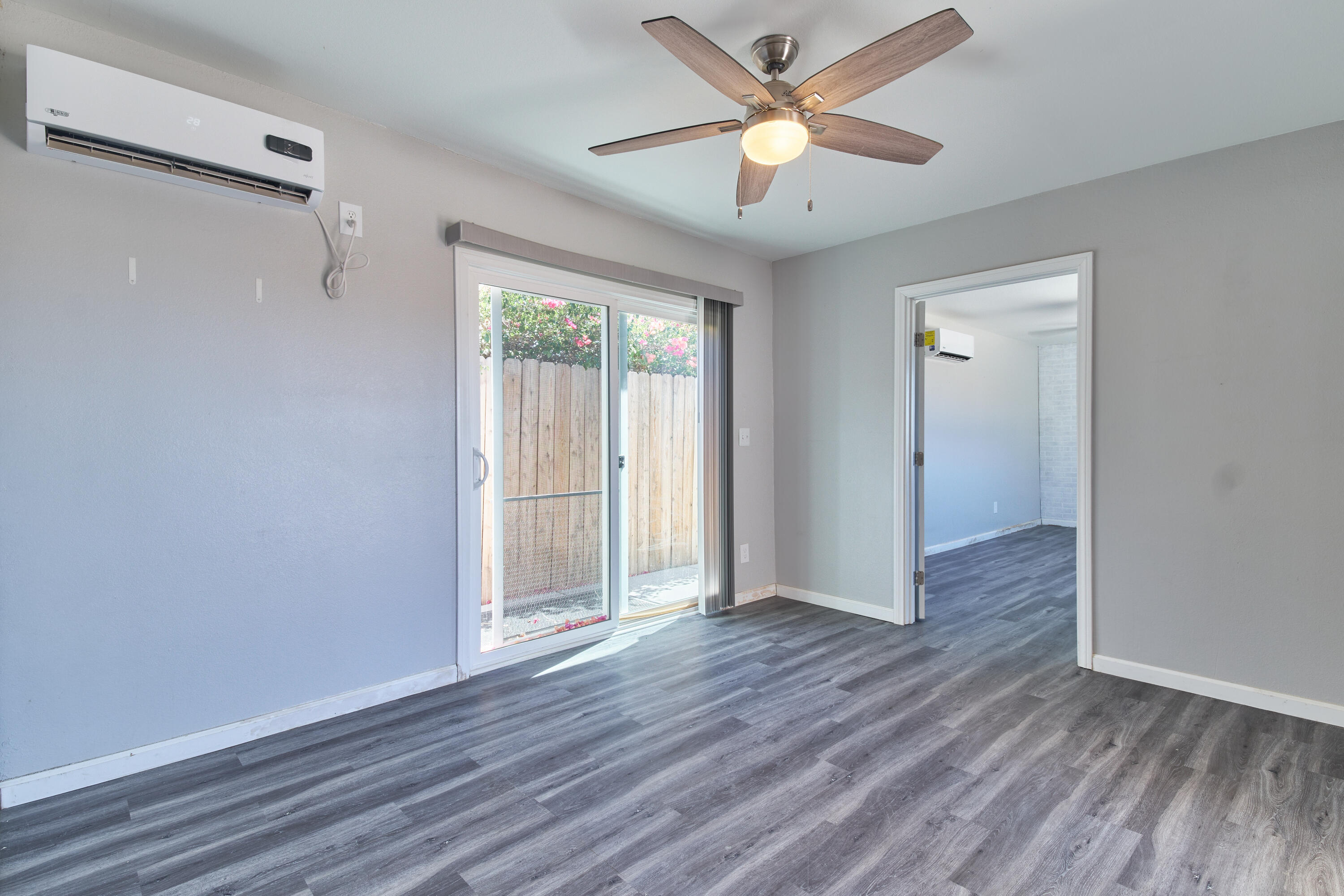 66097 San Jose Road Desert Hot Springs, CA 92240 - Photo 13 of 26 wooden floor in an empty room with a window