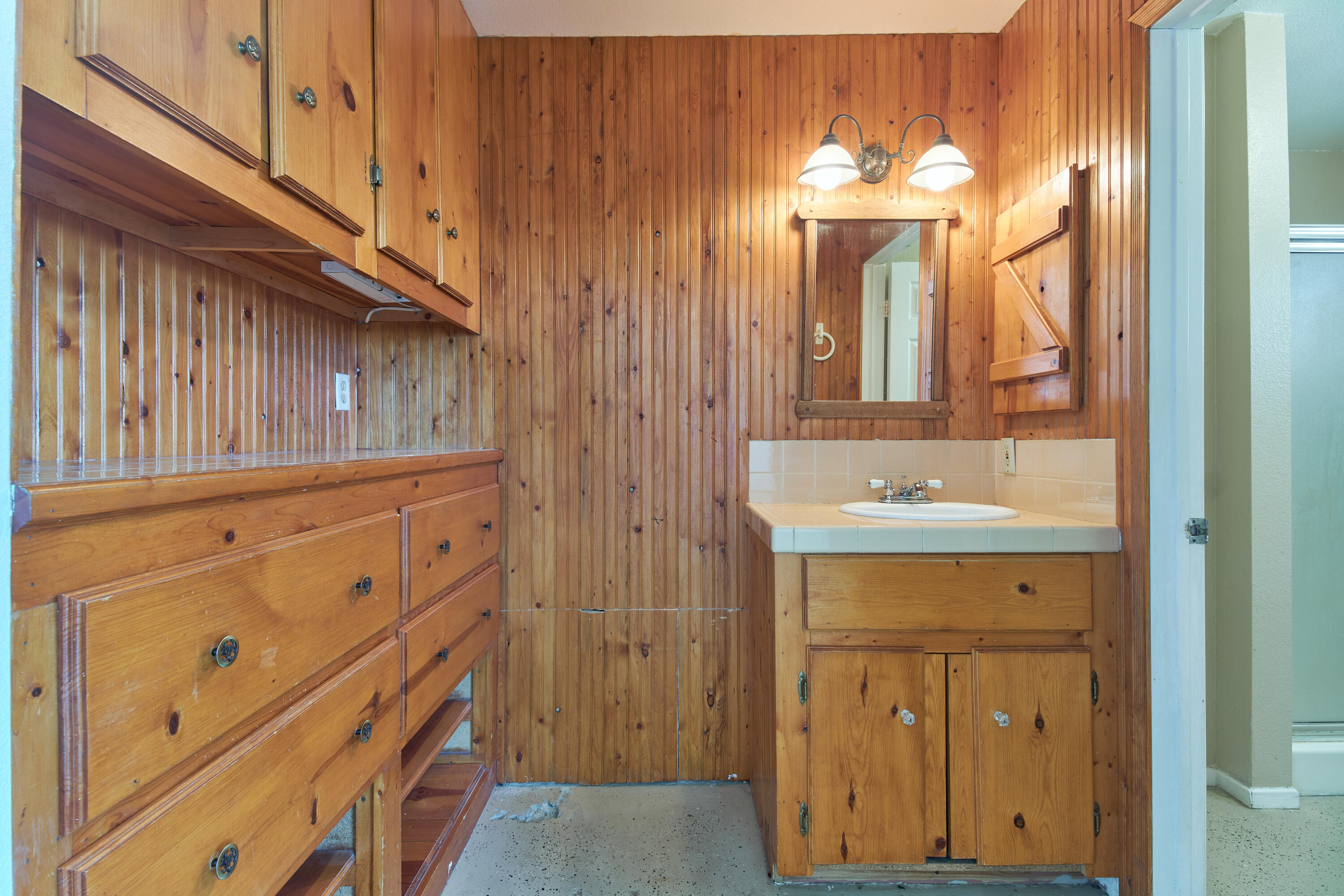 66097 San Jose Road Desert Hot Springs, CA 92240 - Photo 15 of 26 a bathroom with a sink a mirror and a vanity