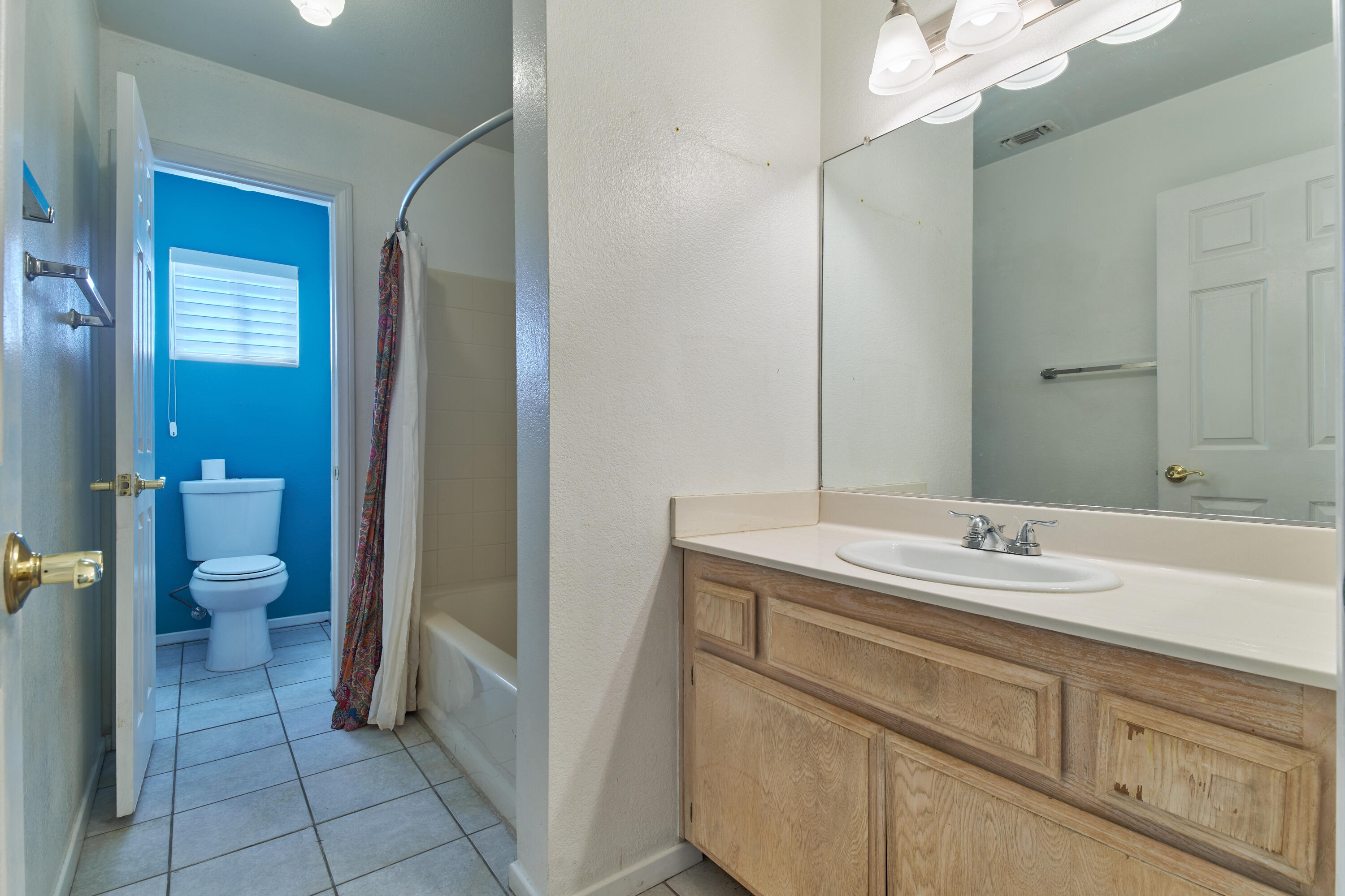 66097 San Jose Road Desert Hot Springs, CA 92240 - Photo 20 of 26 a spacious bathroom with a sink and a mirror