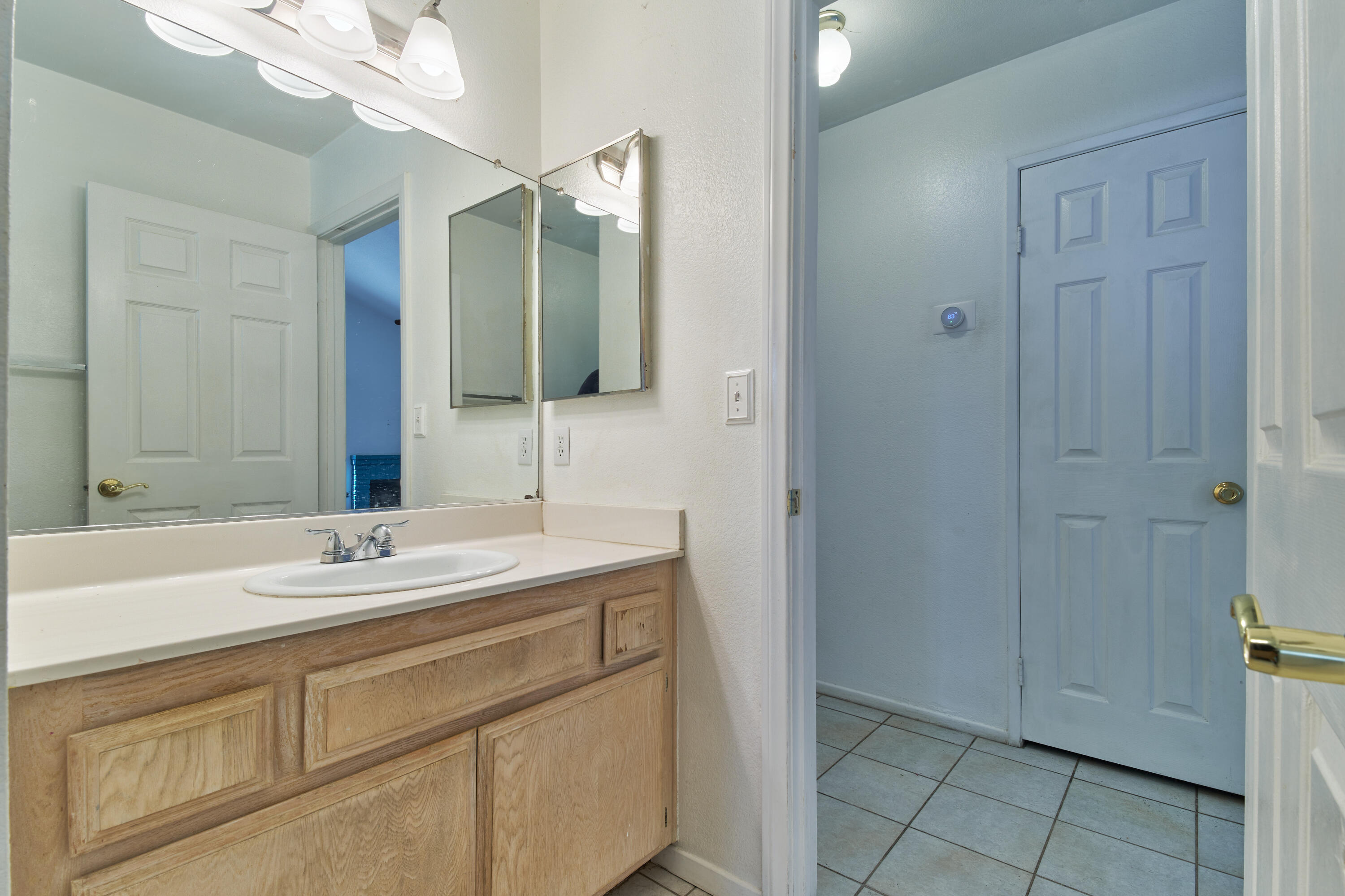 66097 San Jose Road Desert Hot Springs, CA 92240 - Photo 21 of 26 a bathroom with a sink and a mirror