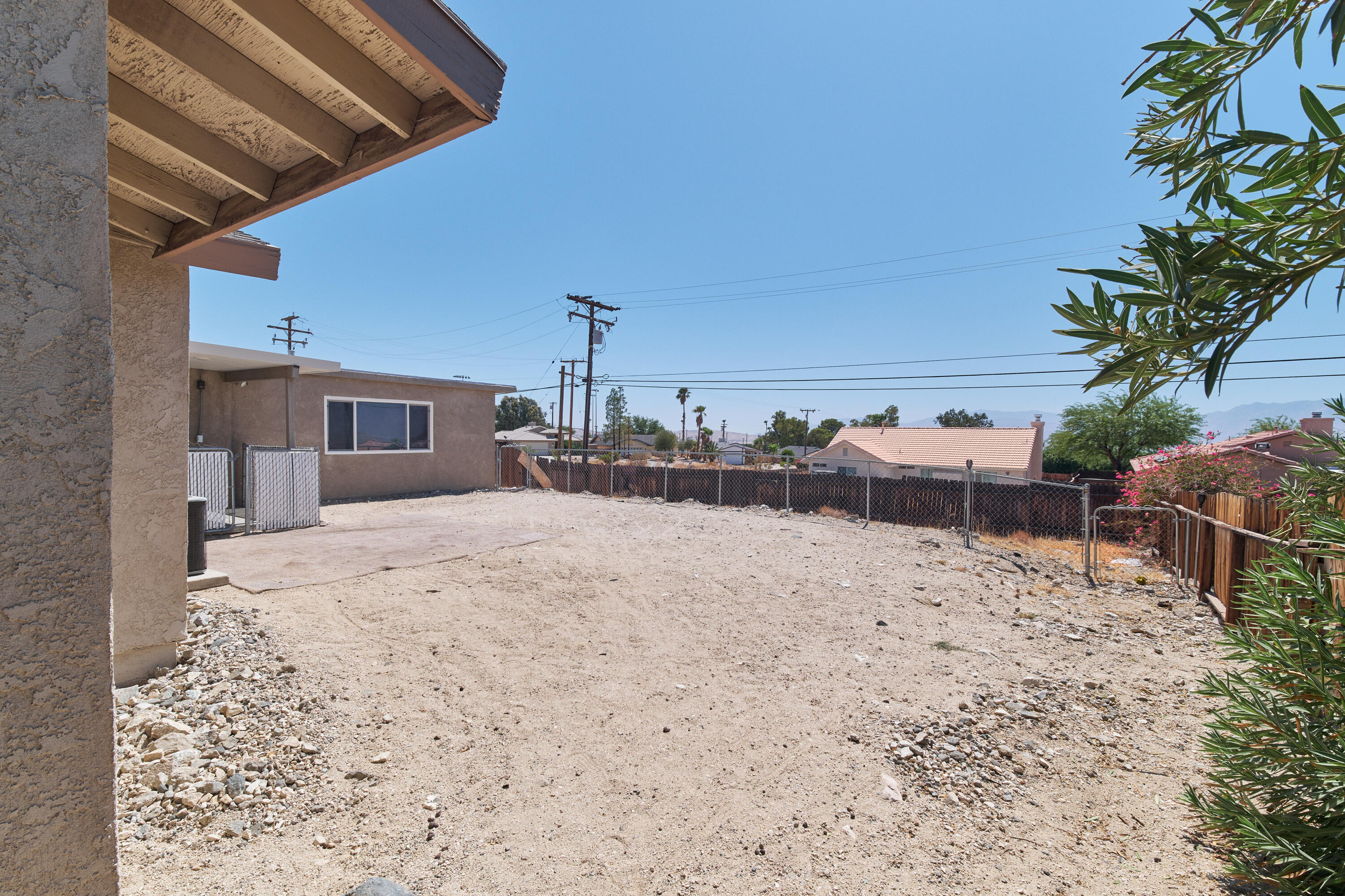 66097 San Jose Road Desert Hot Springs, CA 92240 - Photo 24 of 26 a bed room with a bed