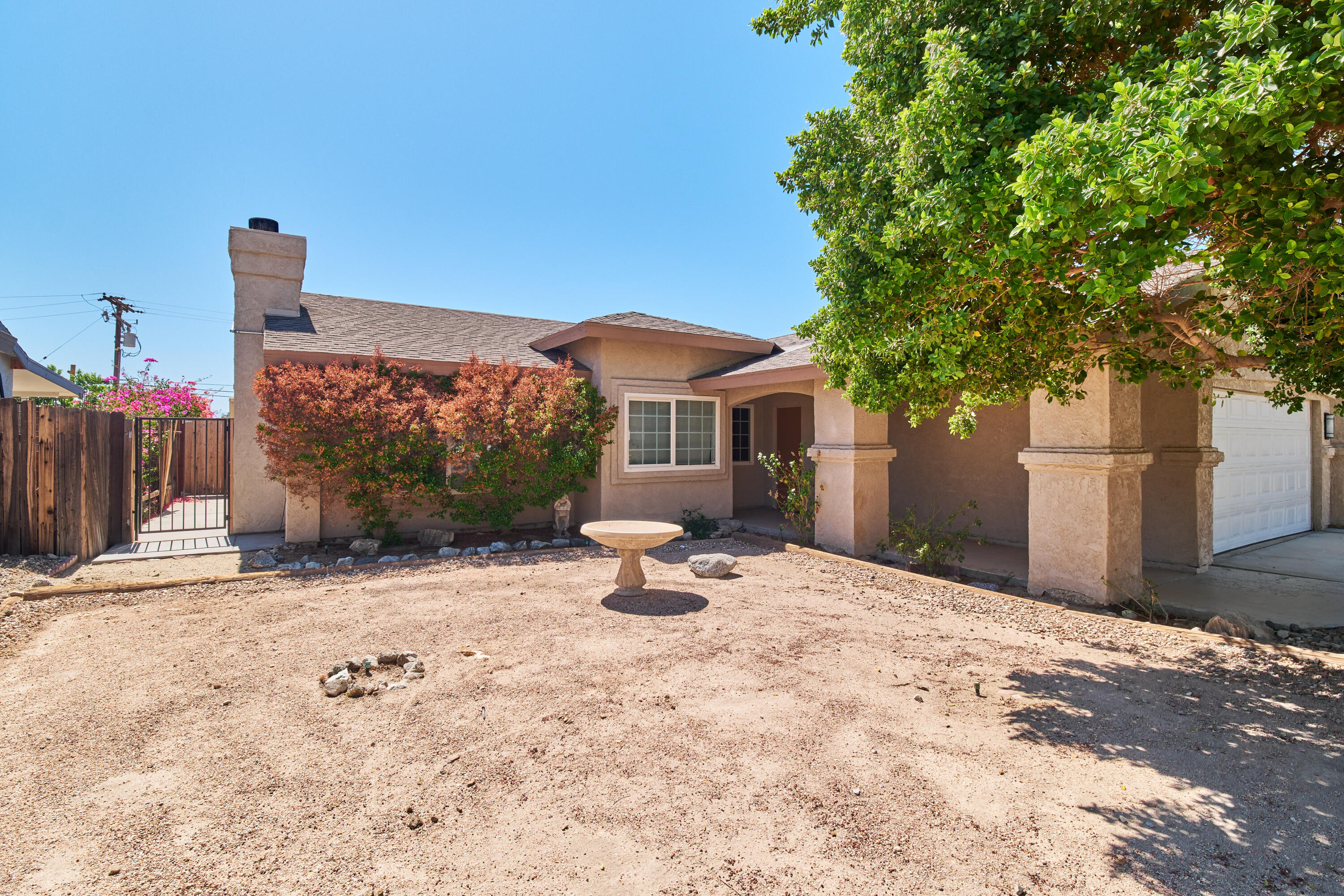66097 San Jose Road Desert Hot Springs, CA 92240 - Photo 3 of 26 a swimming pool with outdoor seating and yard