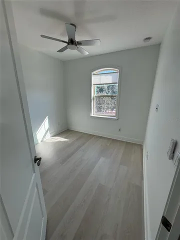 a view of an empty room with a window