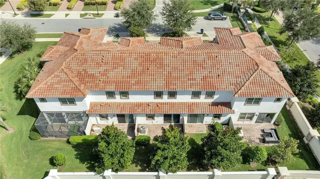 a front view of a multi story residential apartment building with yard