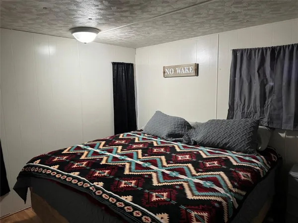 a bedroom with a bed and a walk in closet