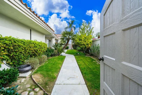 a view of a pathway with a house