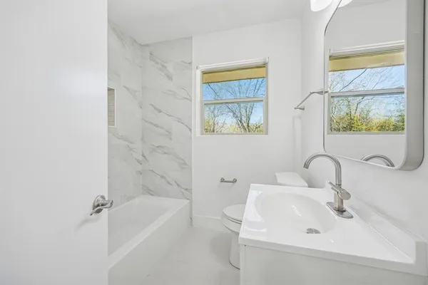 a bathroom with a sink and a bathtub