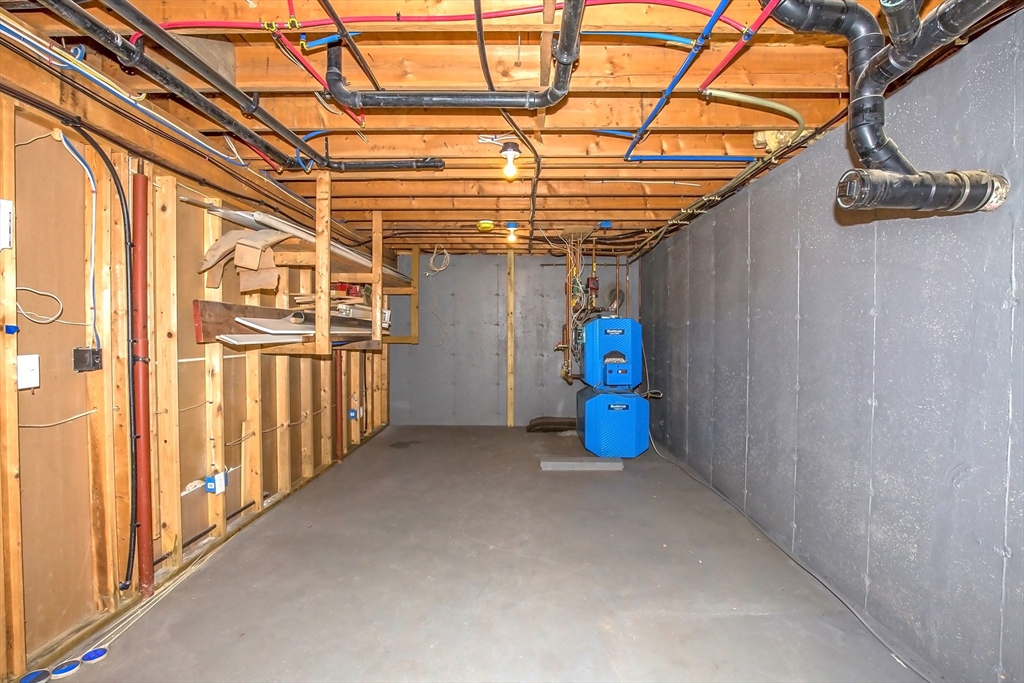 165 Sandisfield Road Sandisfield, MA 01255 - Photo 34 of 37 a view of a room with wooden walls and iron stairs