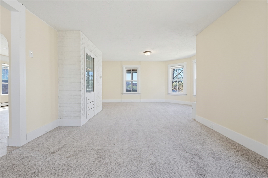 119 Hope Avenue Worcester, MA 01603 - Photo 11 of 42 an empty room with windows