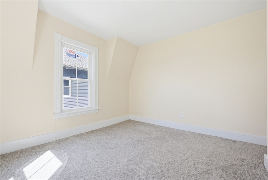 119 Hope Avenue Worcester, MA 01603 - Photo 19 of 42 an empty room with a window