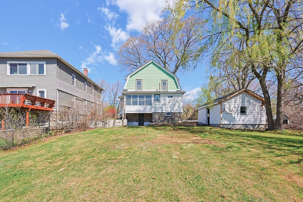119 Hope Avenue Worcester, MA 01603 - Photo 32 of 42 a view of a house with a yard and sitting area