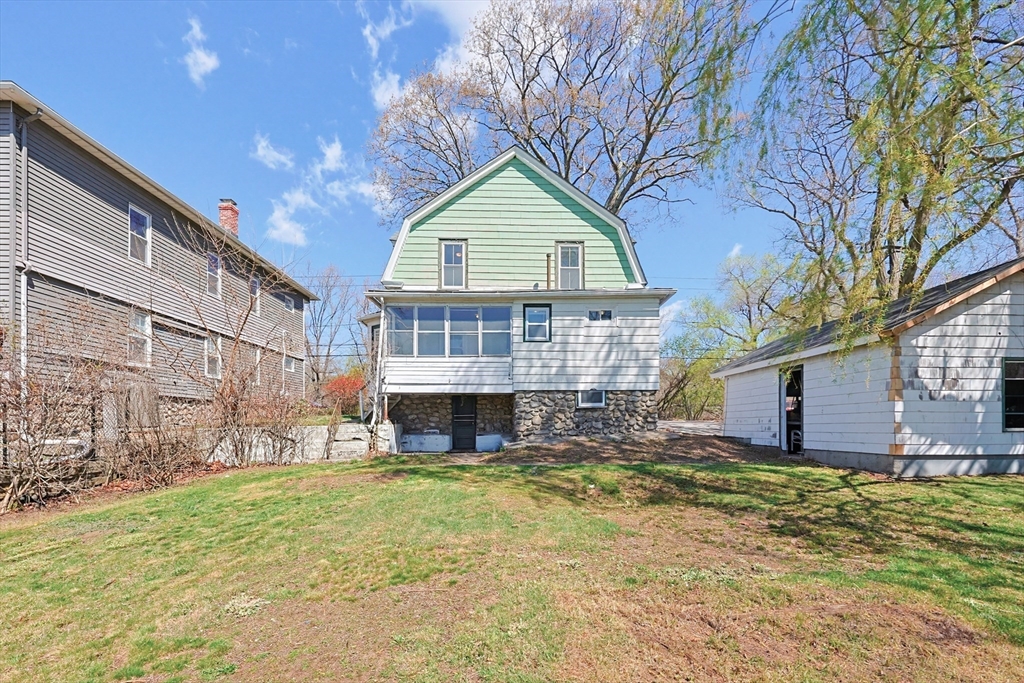 119 Hope Avenue Worcester, MA 01603 - Photo 33 of 42 a view of house with backyard and tree