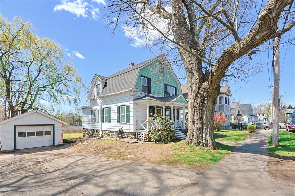119 Hope Avenue Worcester, MA 01603 - Photo 37 of 42 a front view of a house with a yard and tree s