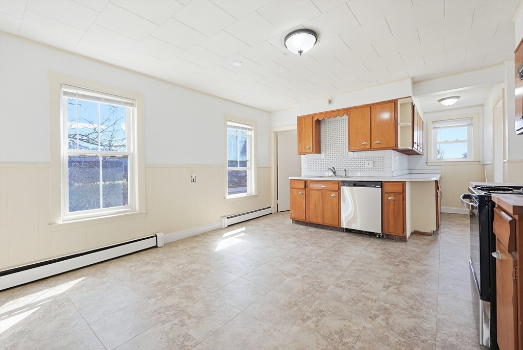 119 Hope Avenue Worcester, MA 01603 - Photo 8 of 42 an empty room with windows and cabinet