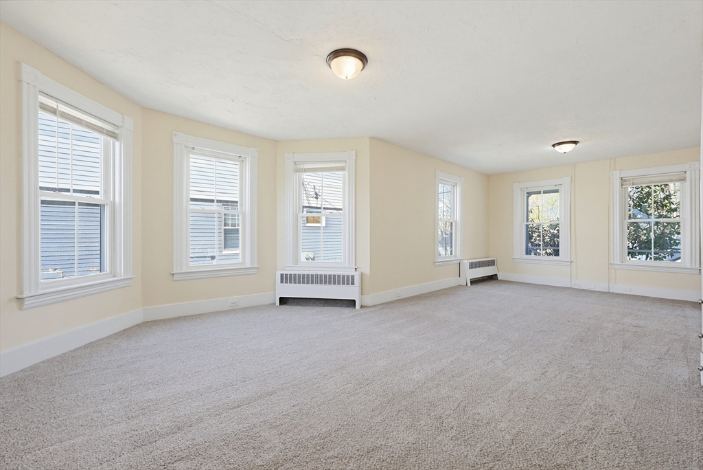 119 Hope Avenue Worcester, MA 01603 - Photo 9 of 42 an empty room with windows