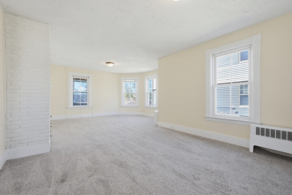 119 Hope Avenue Worcester, MA 01603 - Photo 10 of 42 a view of an empty room with a window