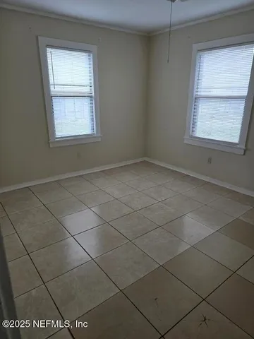 a kitchen with a sink cabinets and window