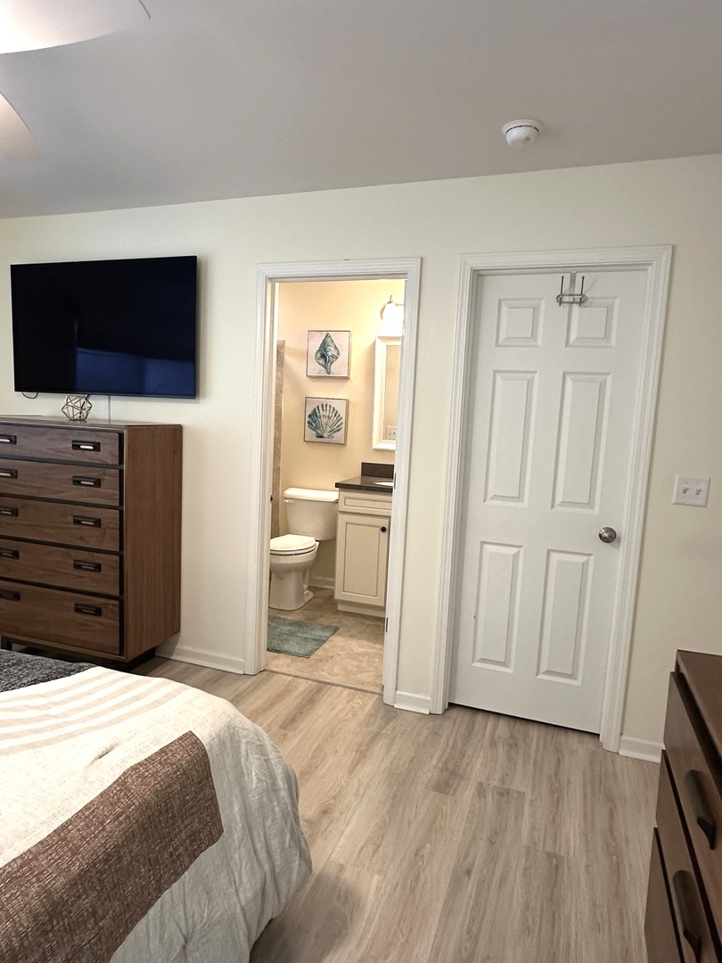 5102 Monroe Street Matteson, IL 60443 - Photo 32 of 54 a bedroom with a bed and a flat screen tv