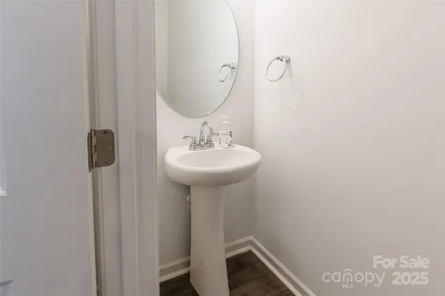 a bathroom with a sink a mirror and vanity
