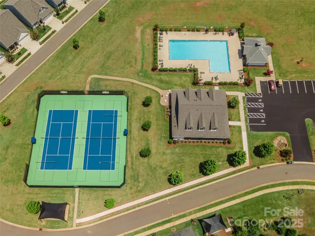 an aerial view of a house with a garden and plants