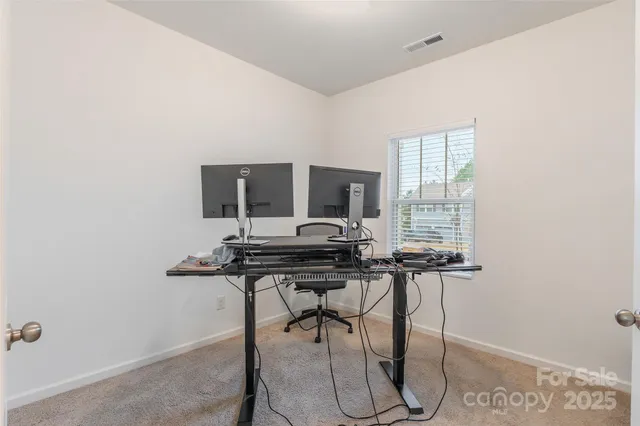 a view of a workspace with furniture