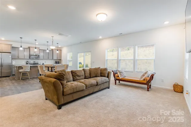 a living room with furniture and a table
