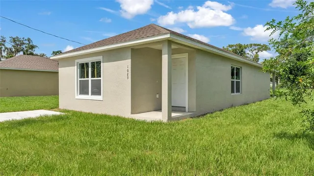 a view of front door and yard