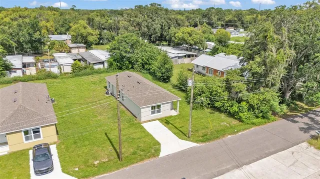 an aerial view of a house with a garden