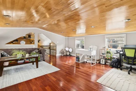 a living room with furniture and a table