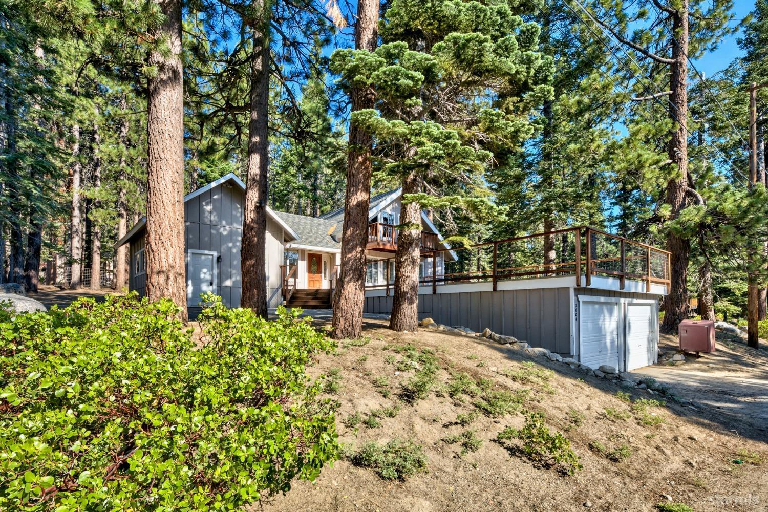 2004 Kickapoo Street South Lake Tahoe, CA 96150 - Photo 1 of 20 a front view of a house with a yard