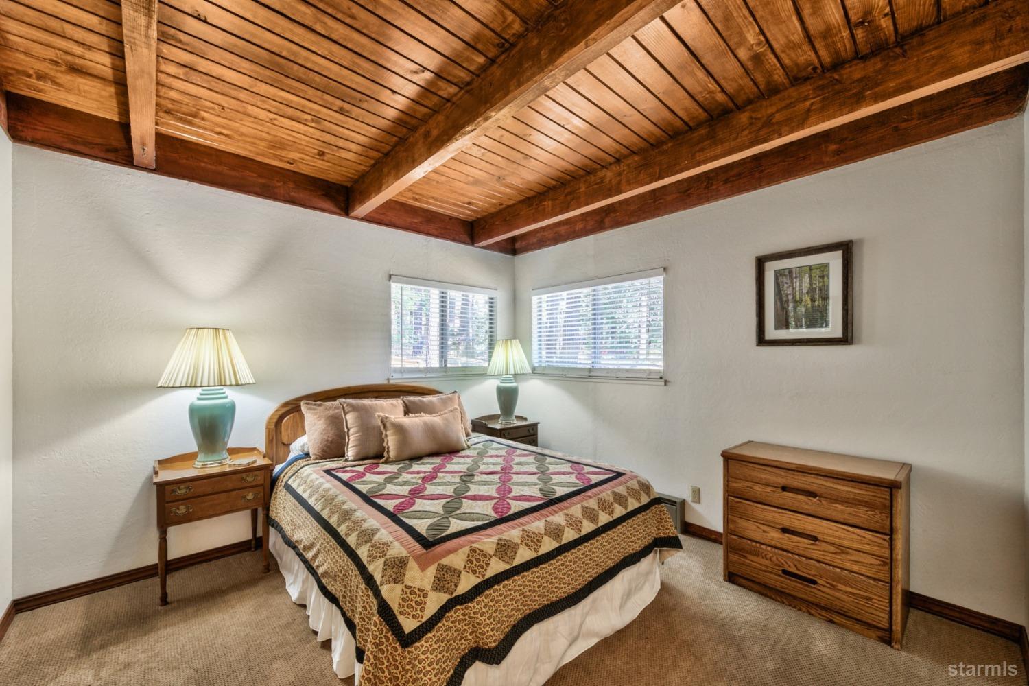 2004 Kickapoo Street South Lake Tahoe, CA 96150 - Photo 13 of 20 a bedroom with a bed and window