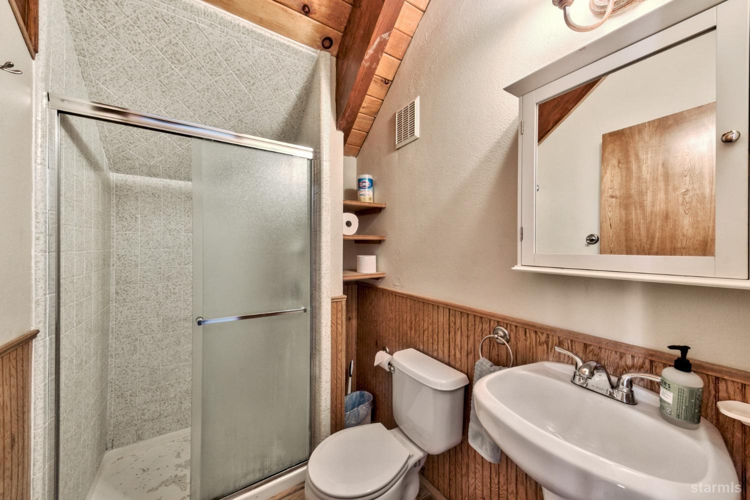 2004 Kickapoo Street South Lake Tahoe, CA 96150 - Photo 19 of 20 a white toilet sitting next to a bathroom sink