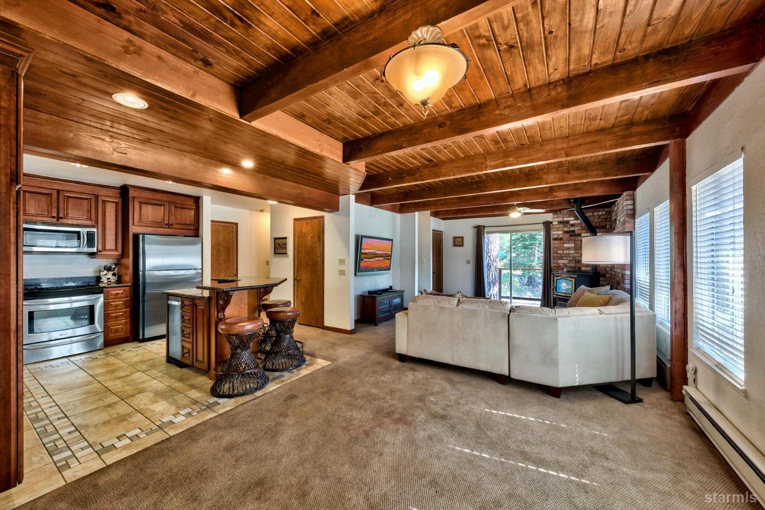 2004 Kickapoo Street South Lake Tahoe, CA 96150 - Photo 5 of 20 a living room with furniture and large windows
