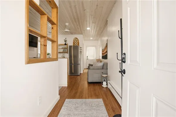 a kitchen with stainless steel appliances granite countertop a refrigerator and a stove top oven