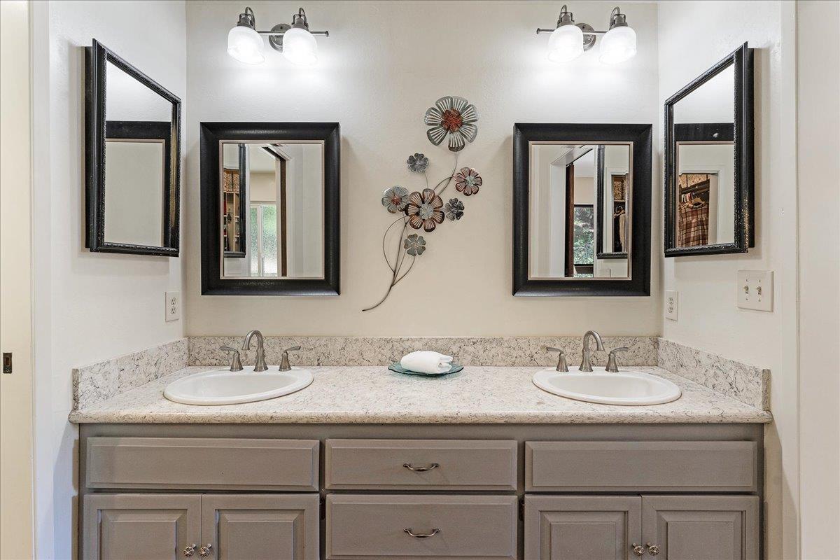 284 Brooktree Ranch Road Aptos, CA 95003 - Photo 18 of 30 a bathroom with double vanity sinks and a mirror