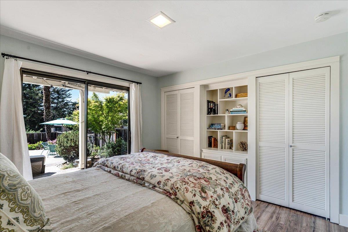 284 Brooktree Ranch Road Aptos, CA 95003 - Photo 22 of 30 a bedroom with a large bed and a window