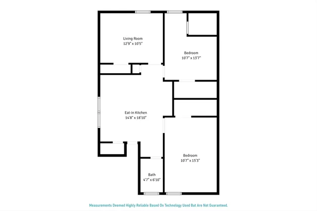 a picture of a bench in front of a wall