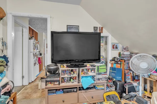 a room with furniture and a flat screen tv
